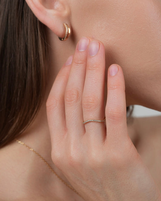 Gold plated band ring with cubic zirconia stones worn on hand, everyday minimalist ring