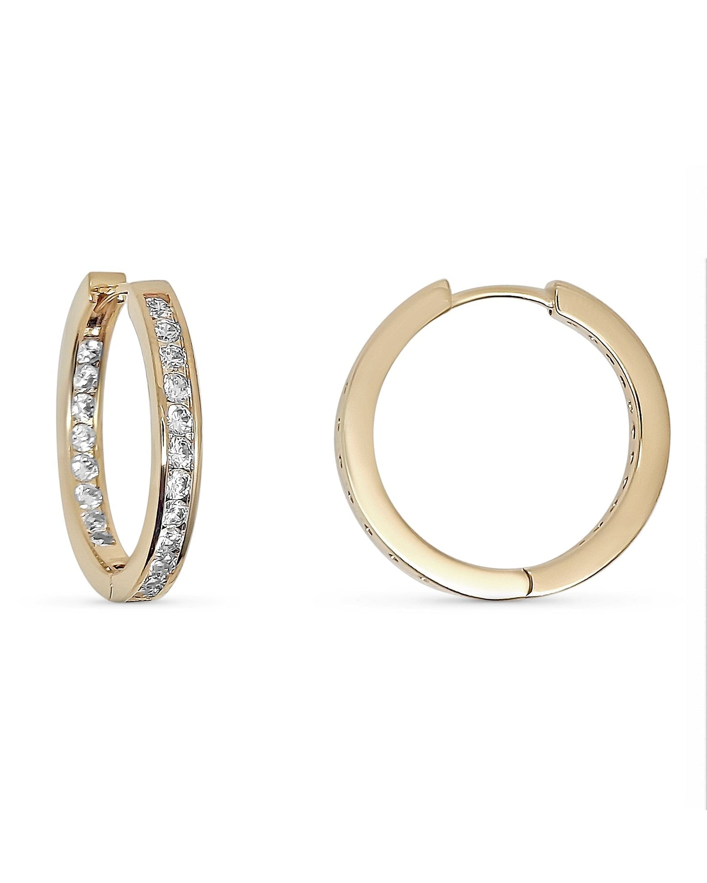 Gold hoop earrings with embedded stones and a measurement scale on the right.