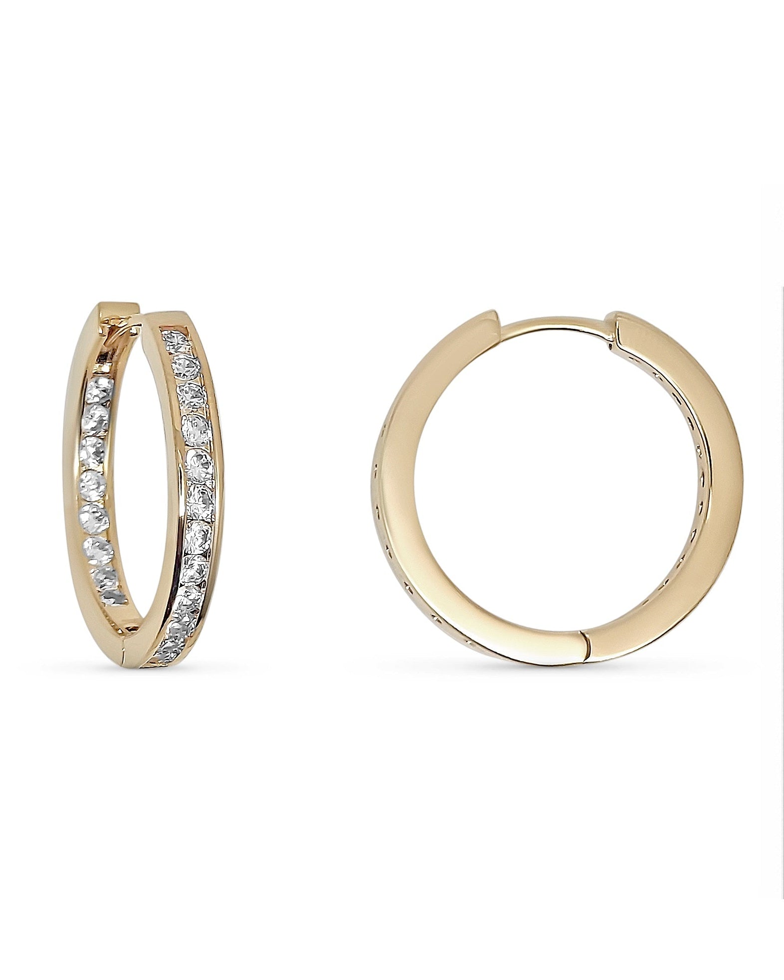 Gold hoop earrings with embedded stones and a measurement scale on the right.