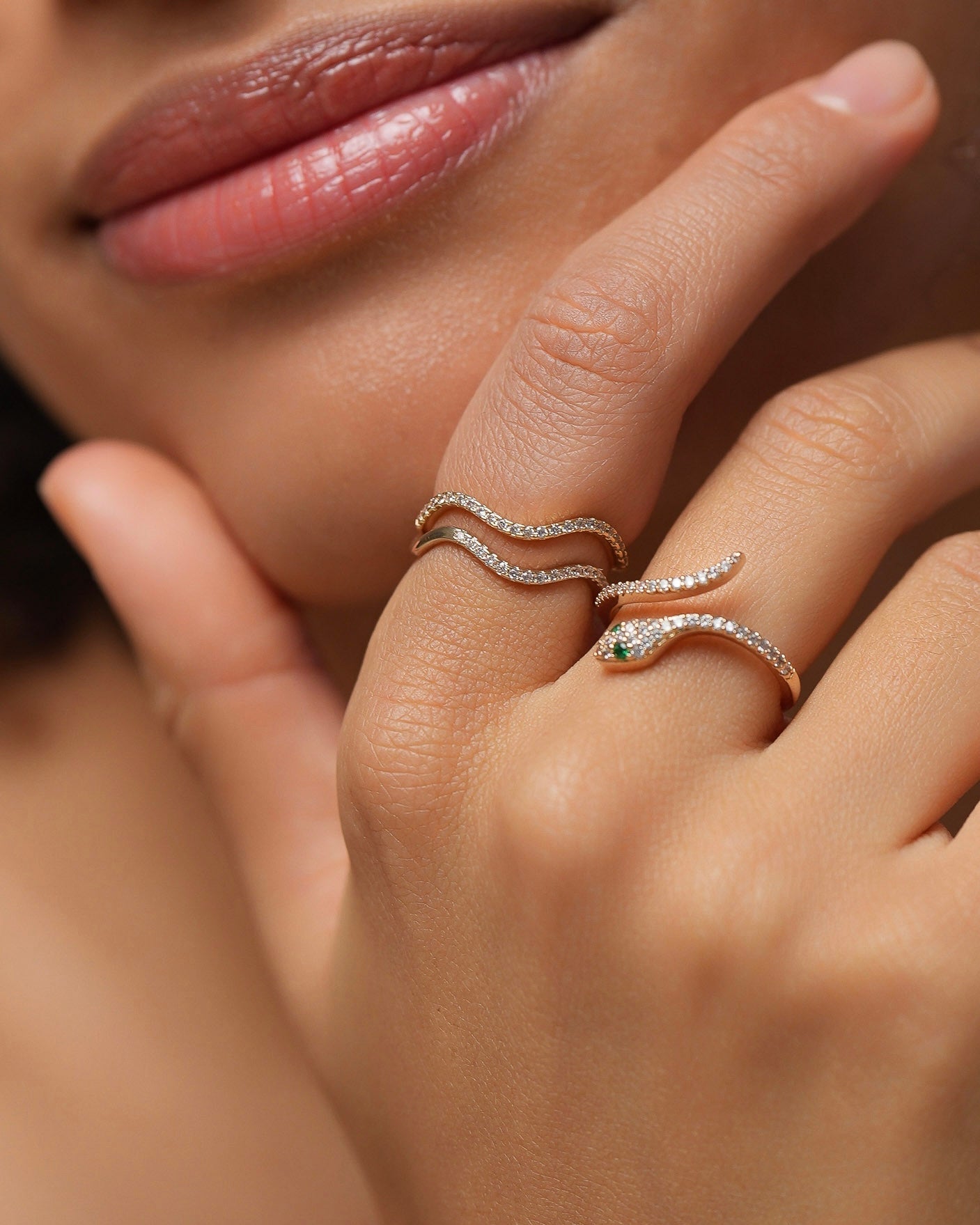 snake ring with cubic zirconia jewelry worn on finger by woman