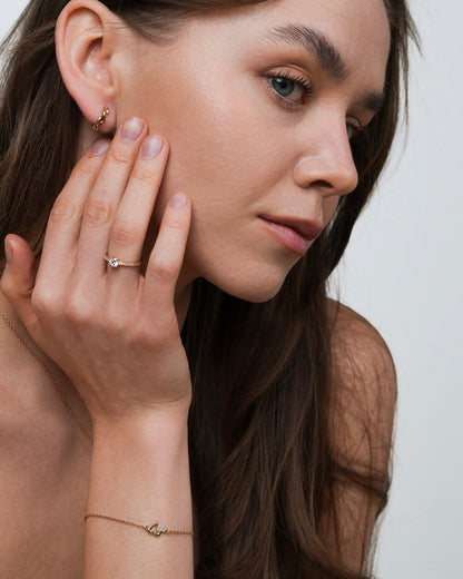 Gold plated solitaire ring with round cubic zirconia side view