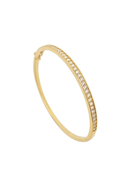 Gold bracelet with small diamonds on a white background