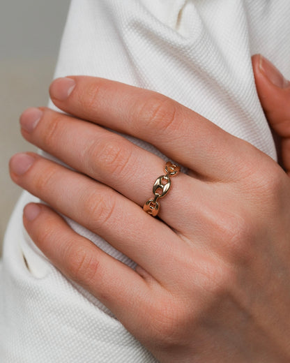 Close-up of chain link ring with rounded, larger links and polished finish