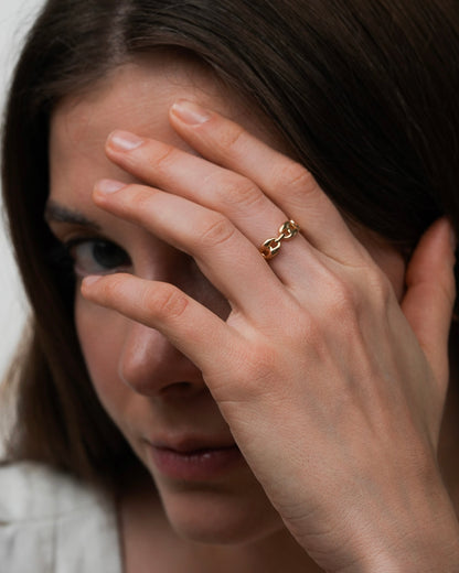 18K gold plated chain link ring worn on hand of a model, rounded link design