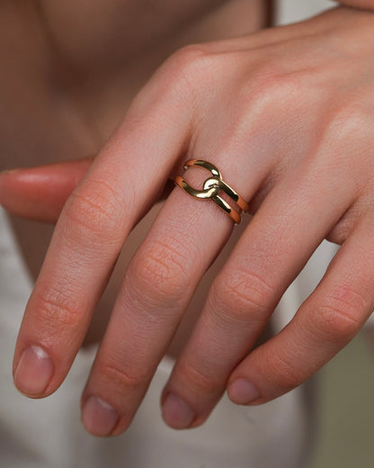Close up of gold-plated ring on hand, smooth surface and elegant shape