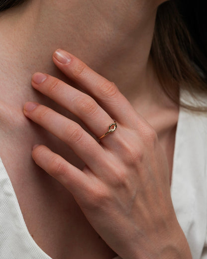 Fira gold knot ring in 18k gold plating, delicate stackable gold band ring on hand