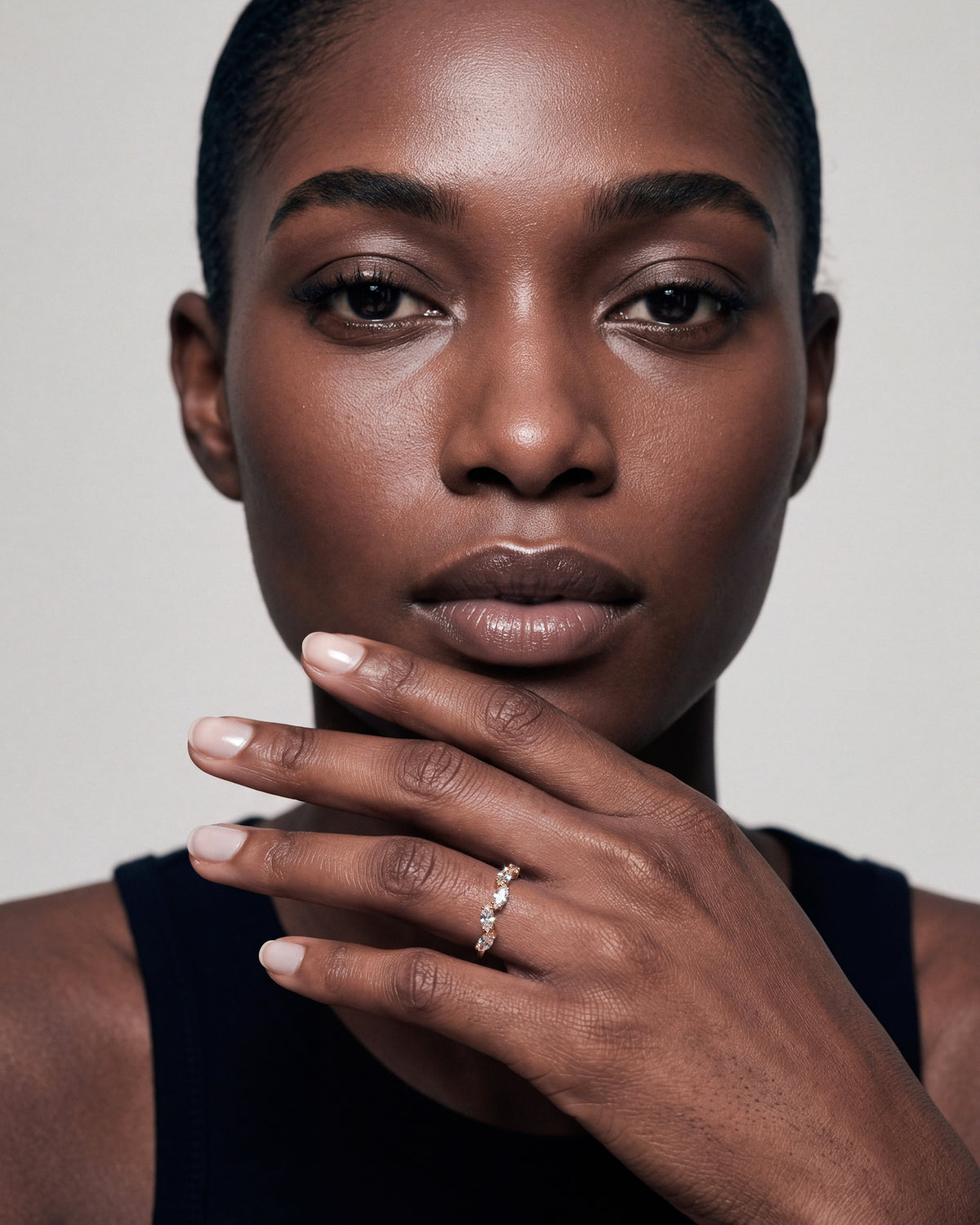 Gold-plated marquise cubic zirconia ring worn on a woman’s hand