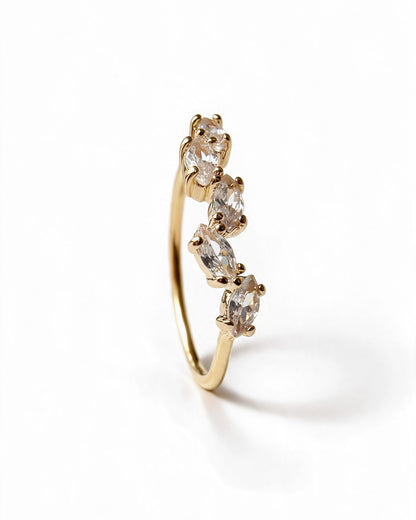 Side view of gold-plated ring with five marquise-cut cubic zirconia stones