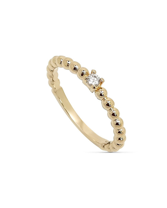 18k gold plated stacking ring with single cubic zirconia and polished beaded band on white background