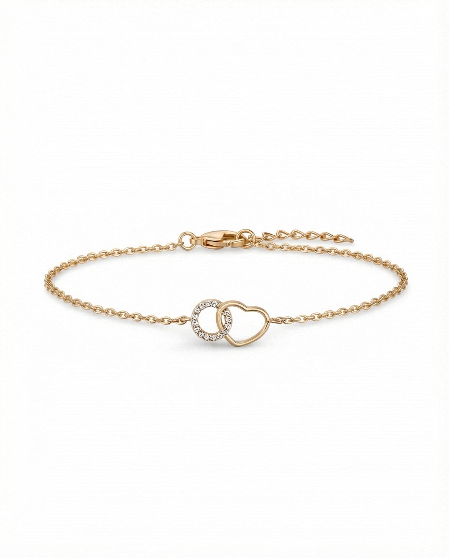 Gold plated heart bracelet with cubic zirconia charm and interlinked circle detail on white background