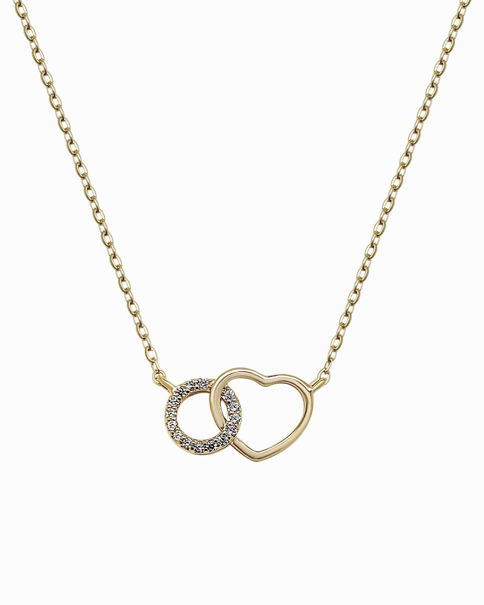 Gold plated heart necklace with cubic zirconia interlinked circle charm on white background