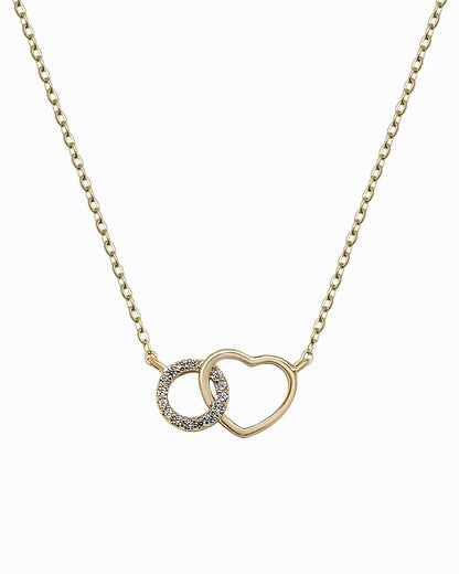 Gold plated heart necklace with cubic zirconia interlinked circle charm on white background