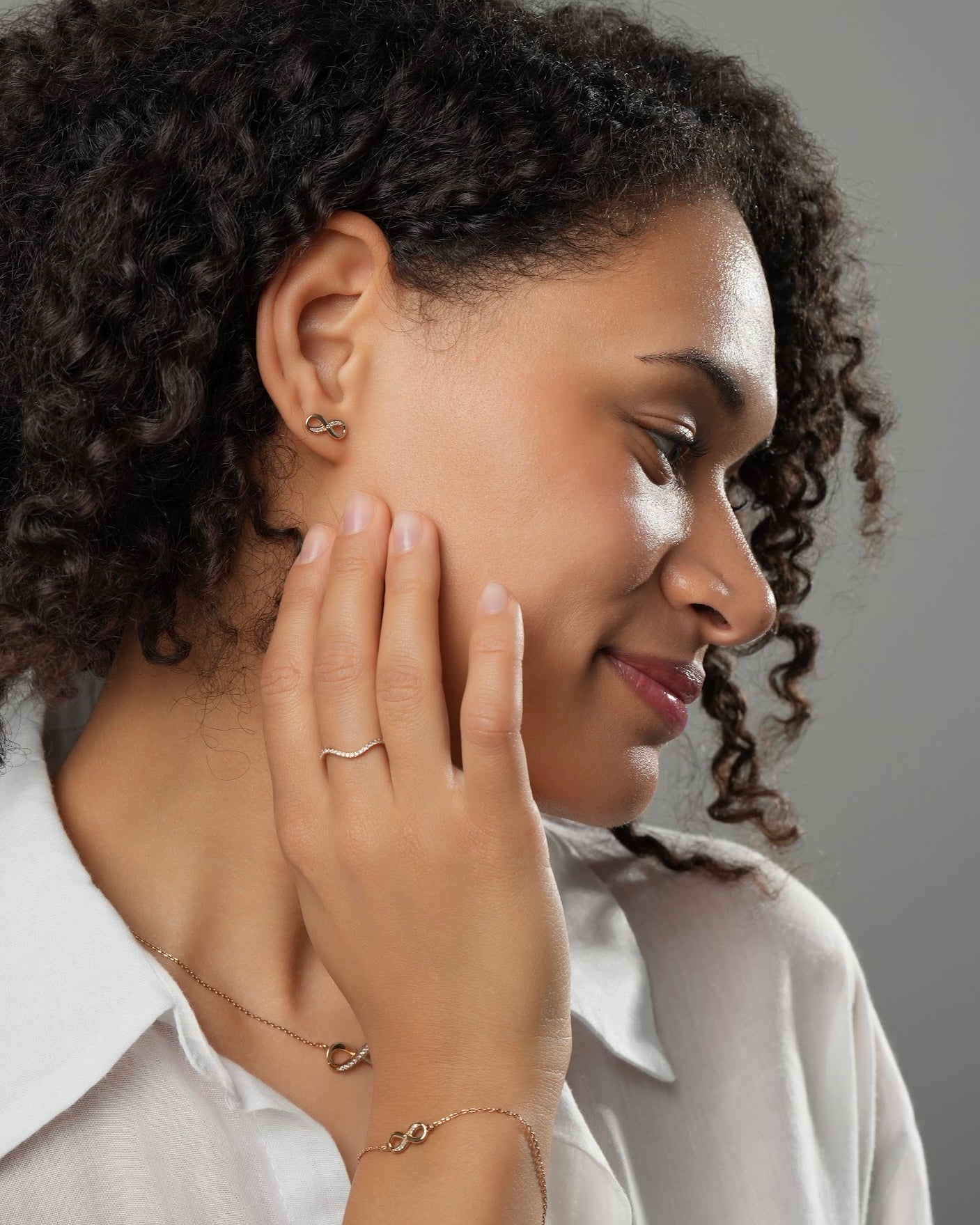 Infinity stud earrings gold plated 18k 3 microns with cubic zirconia, paired with infinity bracelet and necklace, minimalist jewelry set
