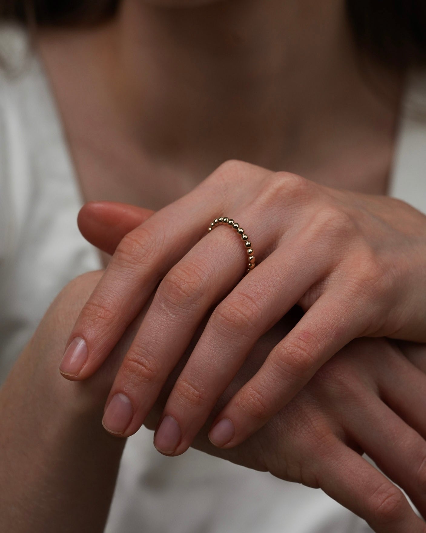 Minimalist 18k gold-plated beaded ring worn on hand