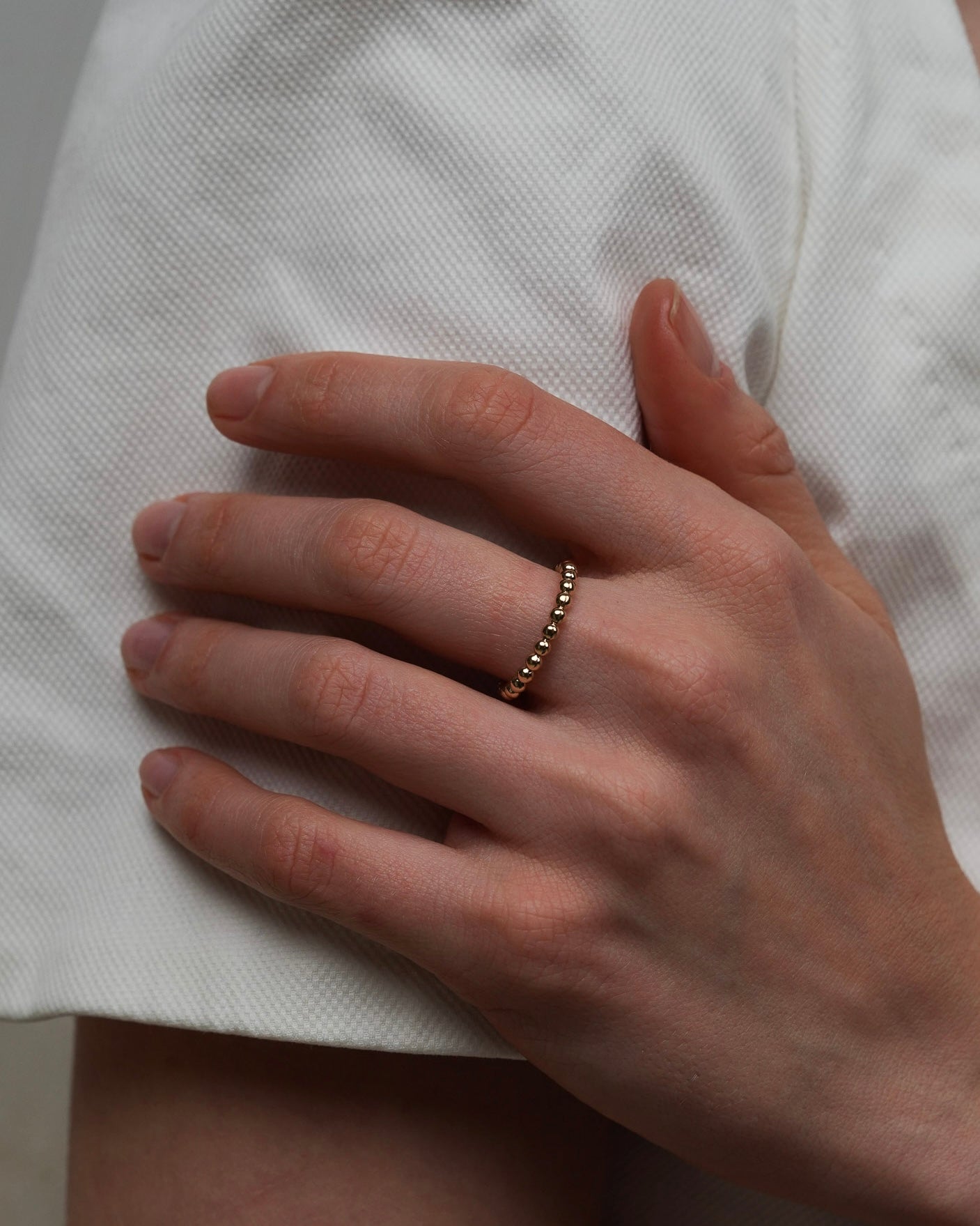 Thin gold-plated beaded ring suitable for stacking detail view
