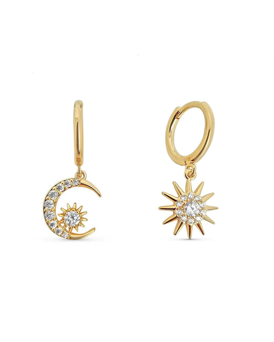 Gold plated hoop earrings Muna with moon and sun charms and cubic zirconia on white background
