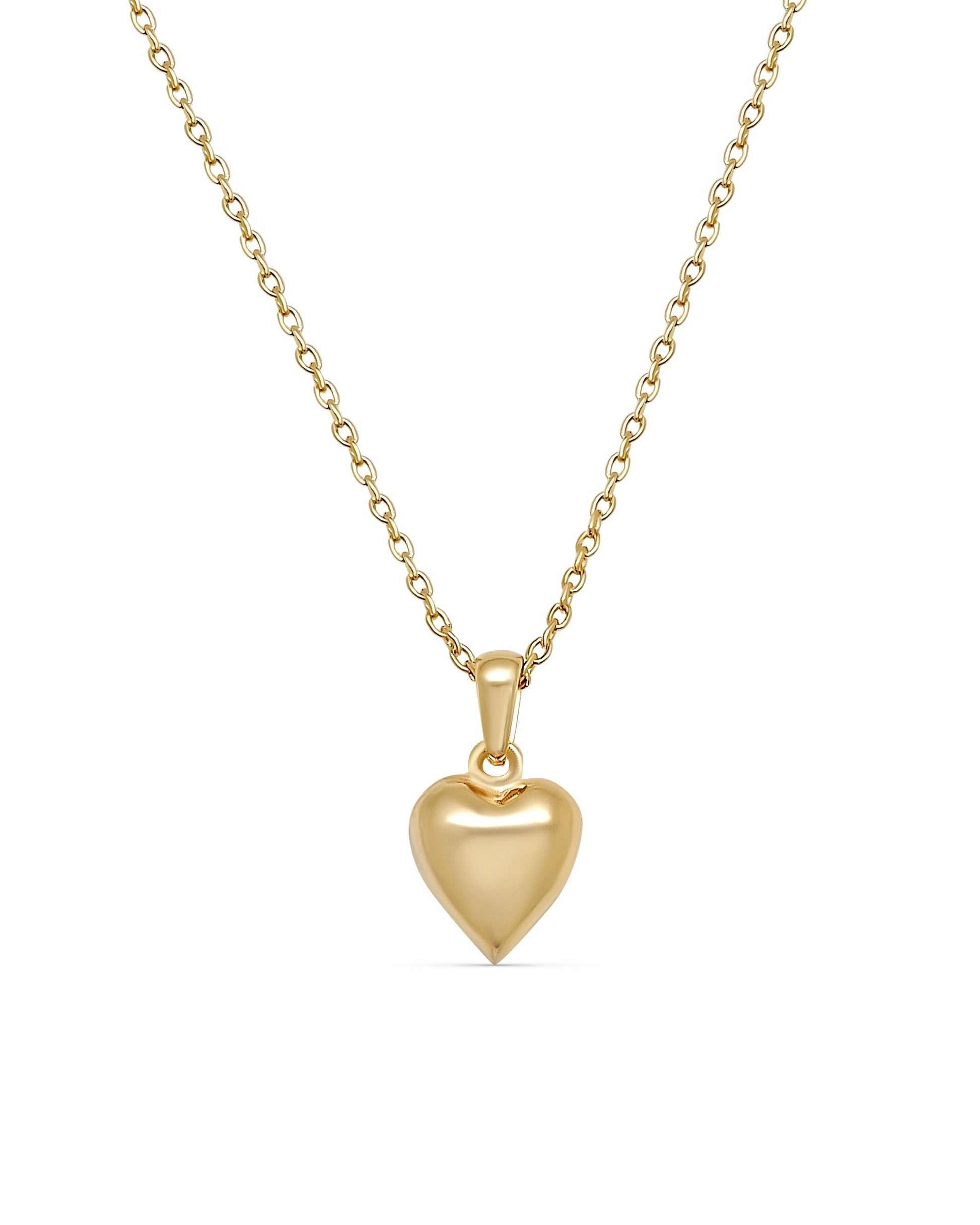 Gold heart-shaped pendant necklace on a white background