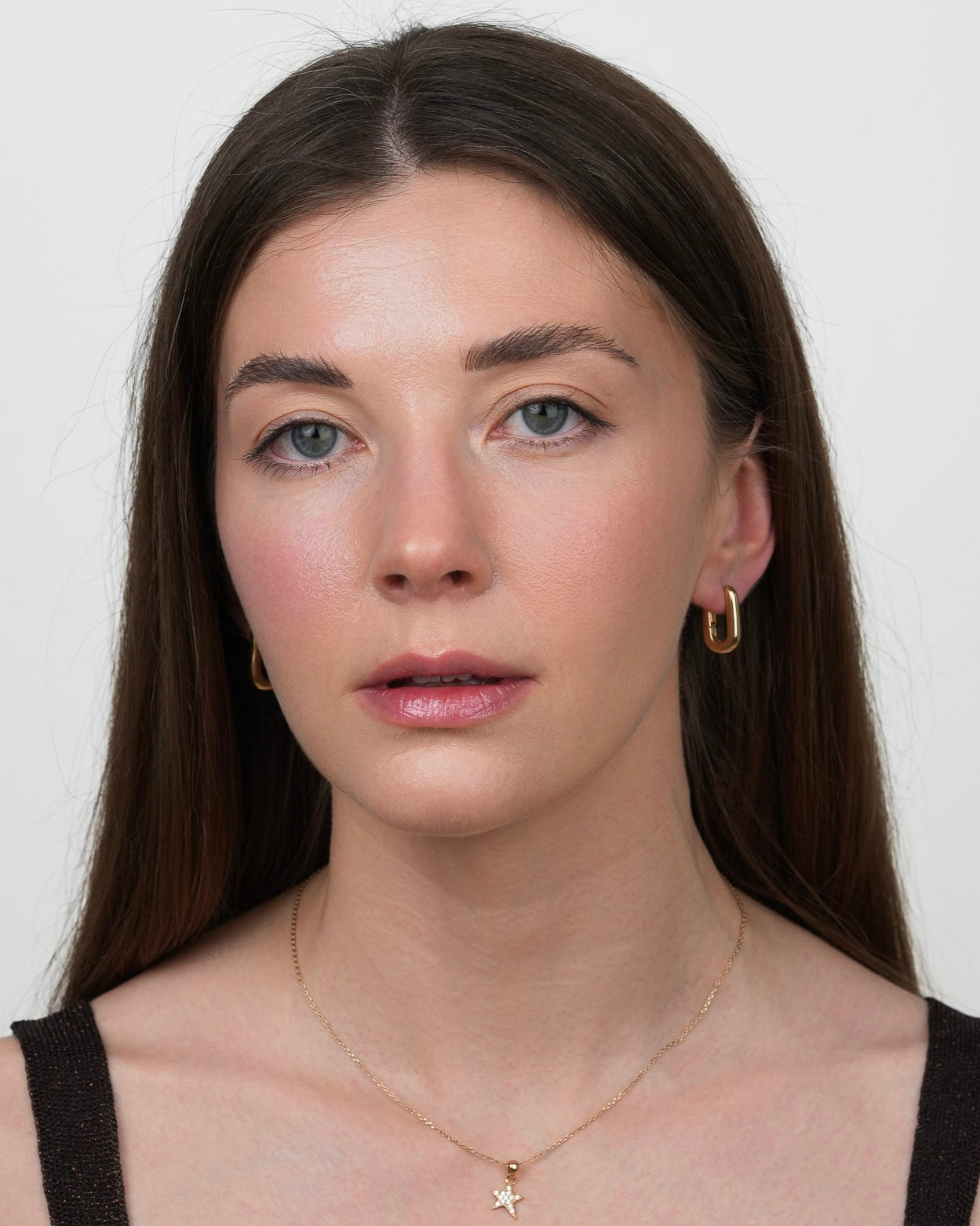 minimalist gold plated hoop earrings rita styled on model, front portrait
