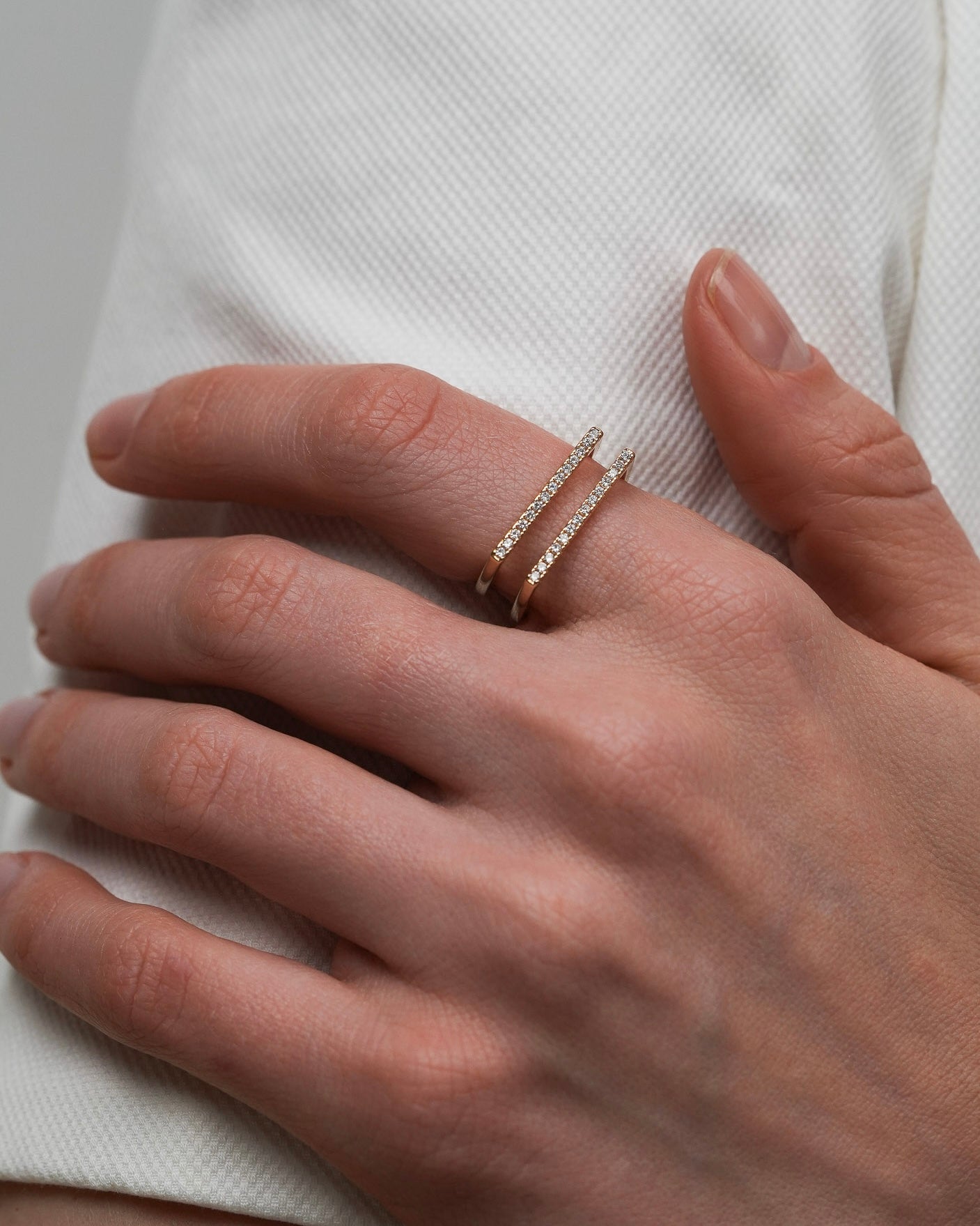 18K gold plated double bar ring with cubic zirconia worn on hand – structured gold statement ring