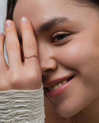 Gold-plated cubic zirconia ring on hand